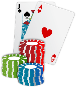 Two cards showing blackjack and some colourful chips
